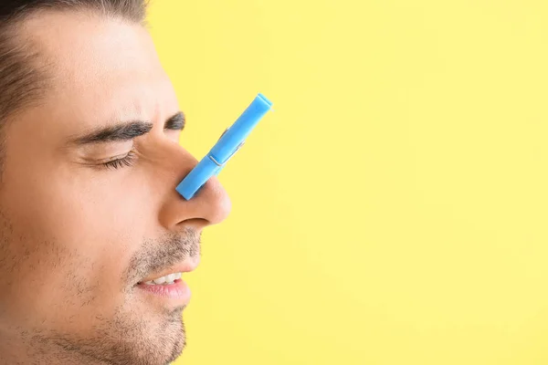 Ill Young Man Clothespin His Nose Color Background Closeup — Stockfoto