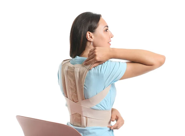 Young Woman Back Brace Sitting Chair White Background — 스톡 사진