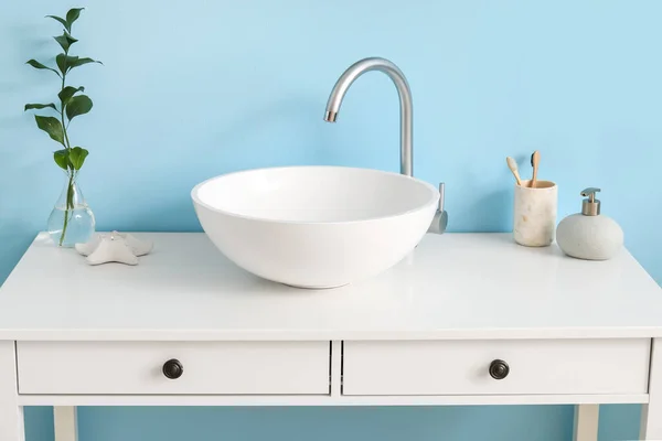 Table Sink Plant Branch Vase Bath Supplies Blue Wall — Stockfoto