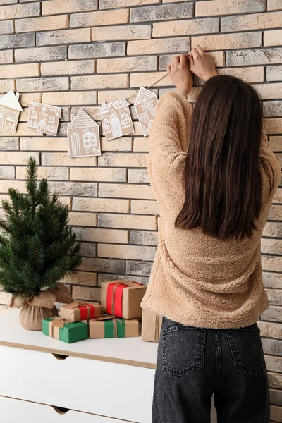 Woman Hanging Rope Cardboard Houses Brick Wall Home — Stock Photo, Image