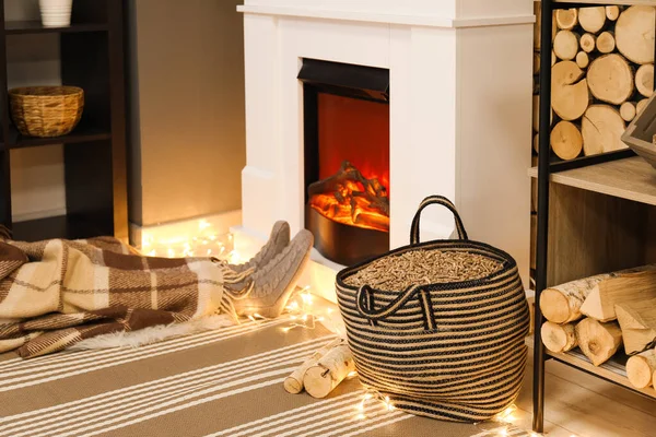 Bag Wood Pellets Woman Warming Fireplace Evening — Stockfoto