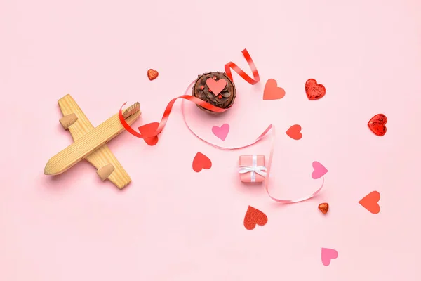 Wooden Airplane Ribbons Muffin Gift Paper Hearts Pink Background Valentine — стоковое фото