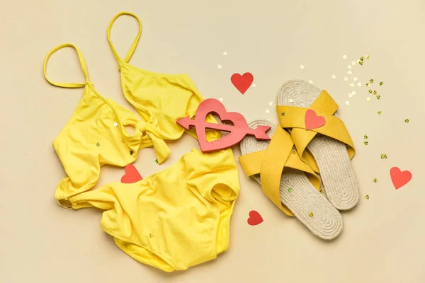 Swimsuit Shoes Confetti Hearts Beige Background Valentine Day Celebration — Stock Photo, Image