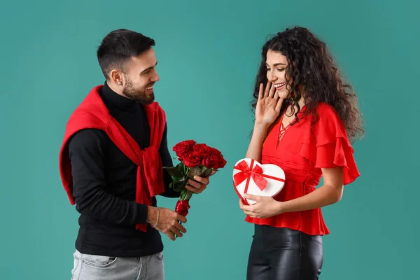 Young Man Greeting His Girlfriend Color Background Valentine Day Celebration — Stockfoto