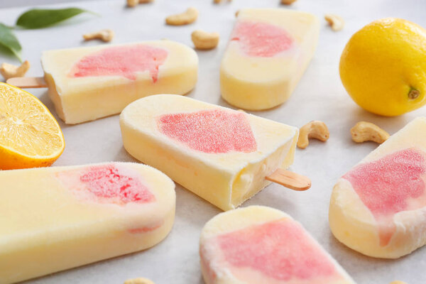 Tasty citrus ice cream on table