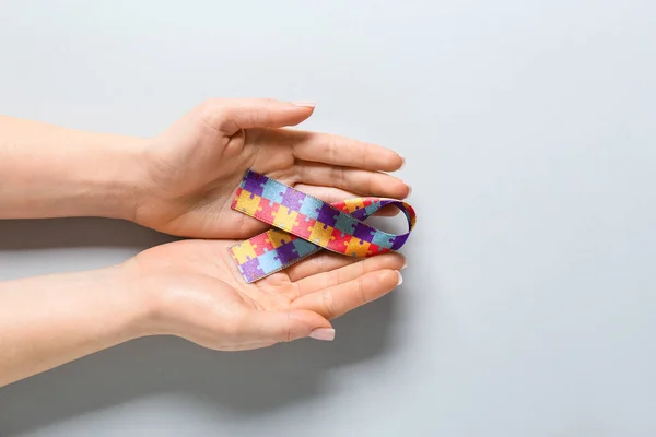 Female Hands Awareness Ribbon Light Background Concept Autistic Disorder — Stock Photo, Image