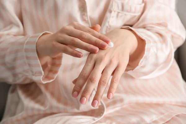 Young Woman Applying Cosmetic Cream Her Hands Home Closeup — Stock Photo, Image