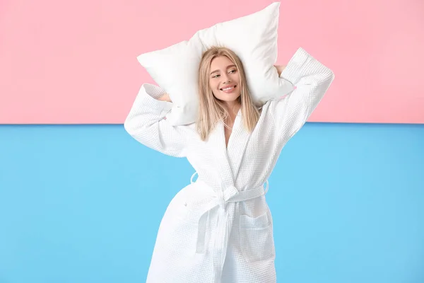 Pretty Young Woman Bathrobe Pillow Pink Blue Background — стоковое фото