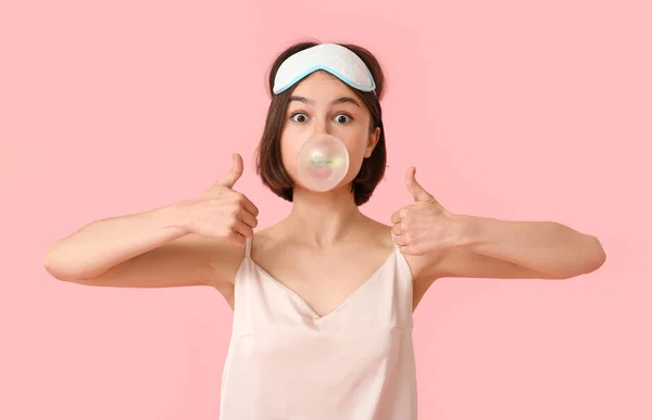 Young Woman Pajamas Chewing Gum Showing Thumb Color Background — Stock Photo, Image