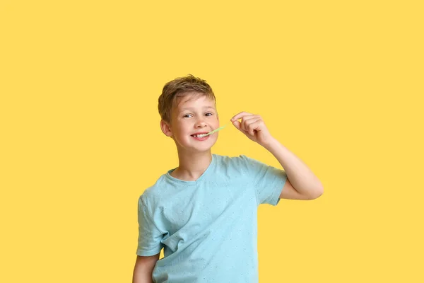 Little Boy Blue Shirt Chewing Gum Yellow Background — Stock Photo, Image