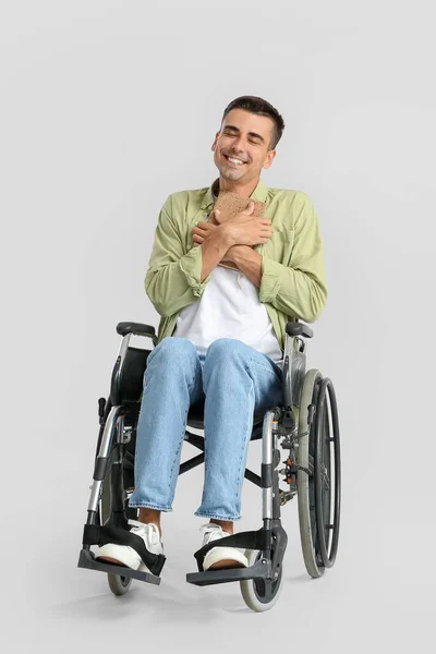 Young Man Wheelchair Book Light Background — Zdjęcie stockowe