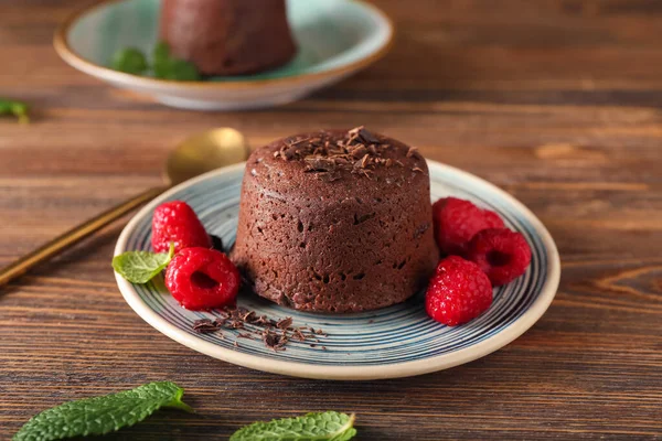 Plate Tasty Lava Cake Fondant Raspberry Wooden Background Closeup — Fotografia de Stock