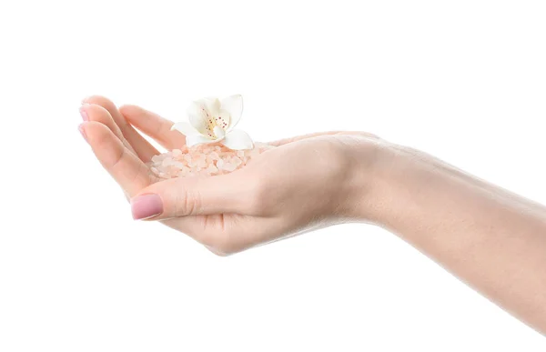 Vrouwelijke Hand Met Orchidee Bloem Zeezout Witte Achtergrond Stockafbeelding
