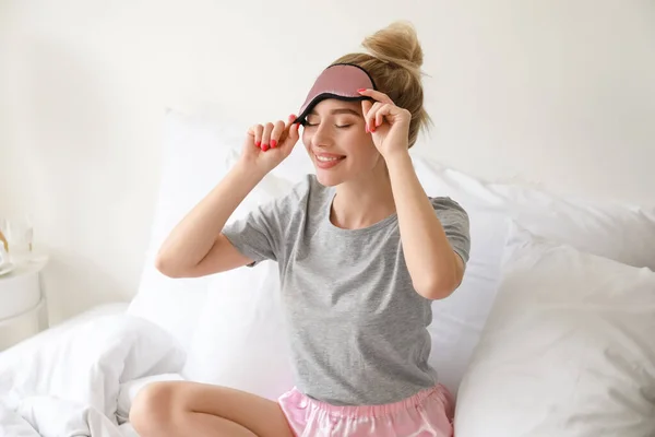 Beautiful Young Woman Taking Sleeping Mask Bedroom — Stockfoto