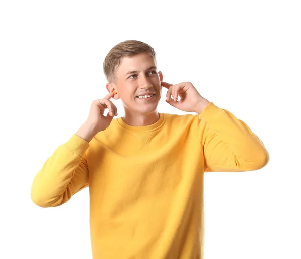 Handsome Young Man Inserting Earplugs White Background — Stock Photo, Image