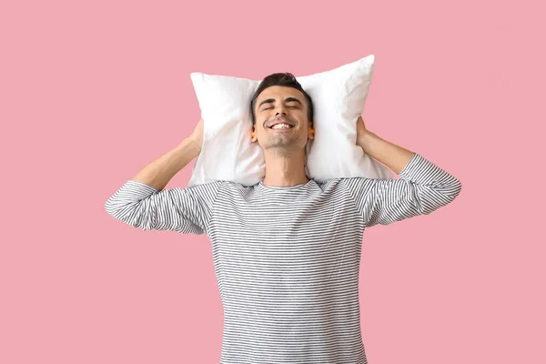 Young Man Ear Plugs Pillow Pink Background — Stock Photo, Image
