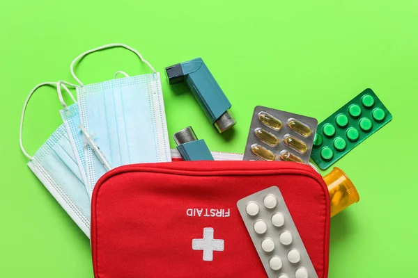 First Aid Kit Asthma Inhalers Pills Masks Green Background — Stock Fotó