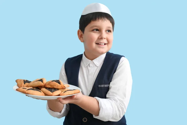 Little Jewish Boy Tasty Hamantaschen Purim Holiday Color Background — Fotografia de Stock