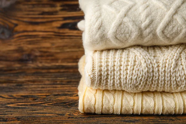 Stylish Baby Sweaters Wooden Background Closeup — Stock Photo, Image