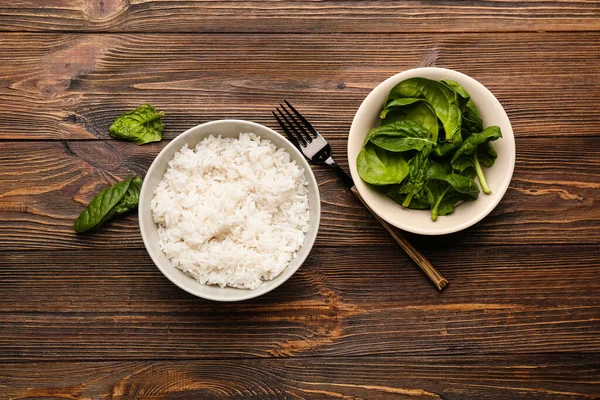 Bowl Tasty Boiled Rice Spinach Wooden Background — Stock Photo, Image