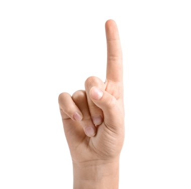 Beyaz arkaplandaki bir şeye işaret eden çocuk