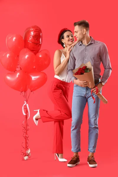 Happy Young Couple Bouquet Flowers Balloons Color Background Valentine Day — Stock Photo, Image