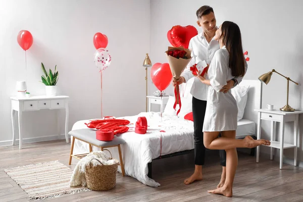 Young Man Greeting His Girlfriend Valentine Day Home — Stock Photo, Image