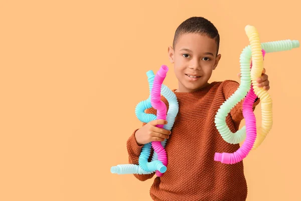 Little African American Boy Colorful Pop Tubes Beige Background — Stock Photo, Image