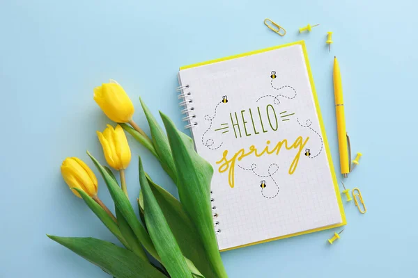 Notebook Text Hello Spring Yellow Tulip Flowers Stationery Blue Background — Stock Photo, Image