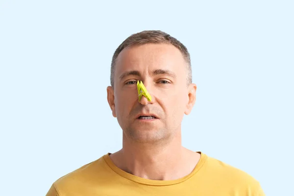 Ill Mature Man Clothespin His Nose Color Background — Stock Photo, Image
