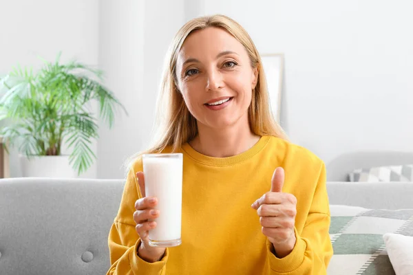 Mature Woman Glass Milk Showing Thumb Home — Stock Photo, Image