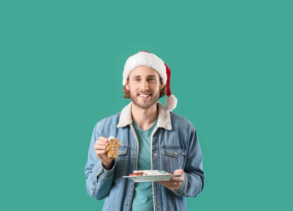 Handsome Man Santa Hat Holding Plate Gingerbread Cookies Green Background — Stock Photo, Image