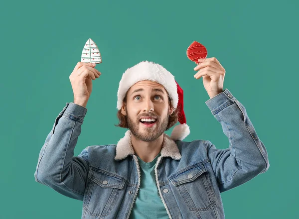Handsome Man Santa Hat Gingerbread Cookies Green Background — Stock Photo, Image