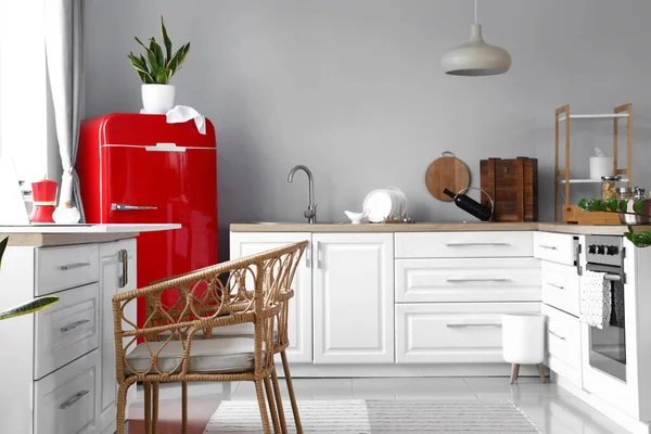 Interior Light Modern Kitchen Red Fridge White Counters Wicker Chairs — Stock Photo, Image