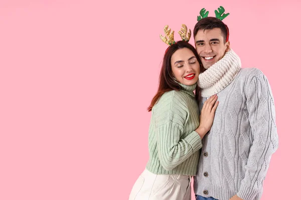 Happy Young Couple Warm Sweaters Deer Horns Color Background — Stock Photo, Image