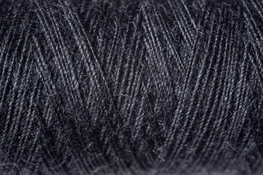 Arkaplan olarak siyah dikiş iplikleri