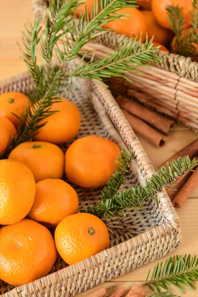 Wicker Trays Tangerines Fir Branches Cinnamon Wooden Background Closeup — Stock Photo, Image