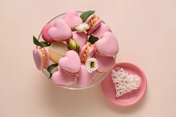 Dessert Stand Tasty Heart Shaped Macaroons Flowers Beige Background — Stok Foto