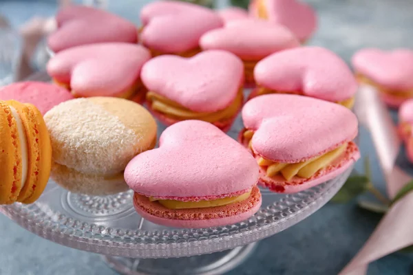 Dessert Stand Tasty Heart Shaped Macaroons Blue Background Closeup — Stock Photo, Image