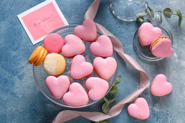 Dessert Stand Tasty Heart Shaped Macaroons Blue Background — Stock Photo, Image