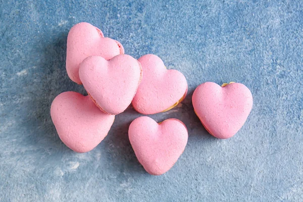 Tasty Heart Shaped Macaroons Blue Background — Stock Photo, Image