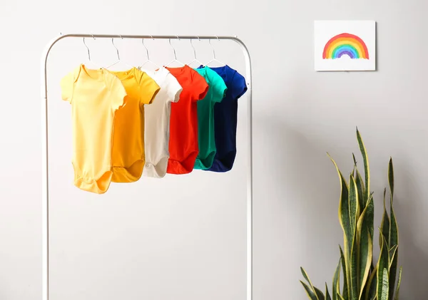 Rack Colorful Baby Bodysuits Light Wall Room — Stock Photo, Image