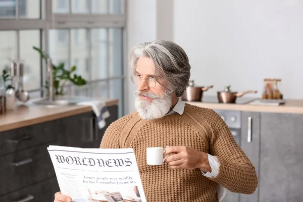 Senior Man Cup Coffee Reading Newspaper Table Kitchen — Stock Photo, Image