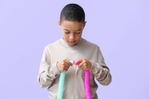 Little African American Boy Pop Tubes Lilac Background — Stock Photo, Image