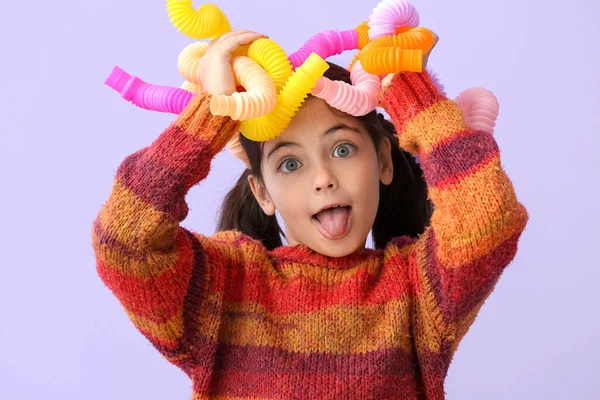 Little Girl Pop Tubes Lilac Background — Stock Photo, Image