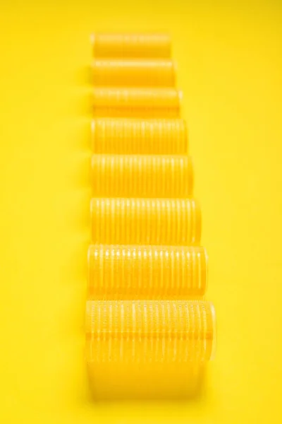 Set Hair Curlers Yellow Background Closeup — Stock Photo, Image