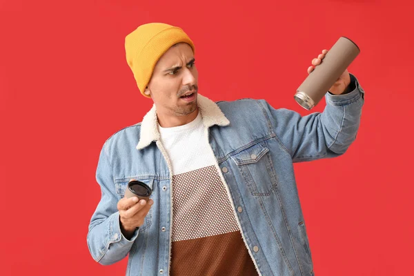 Displeased Man Empty Thermos Color Background — Stock Photo, Image