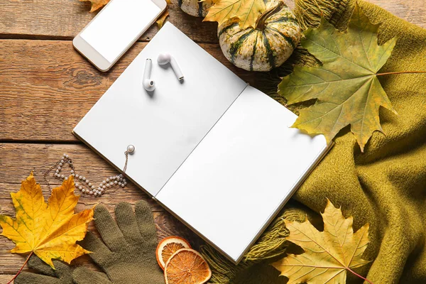 Blank Book Mobile Phone Earphones Autumn Decor Wooden Background — Stock Photo, Image