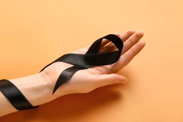 Female Hand Black Ribbon Orange Background Melanoma Concept — Stock Photo, Image