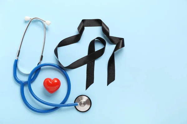 Black Ribbon Stethoscope Heart Blue Background Melanoma Concept — Stock Photo, Image